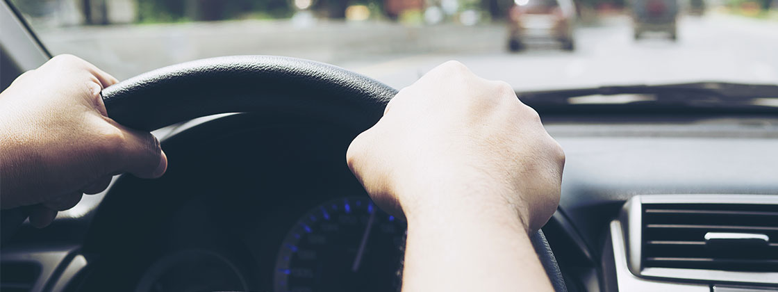Man driving vehicle in traffic